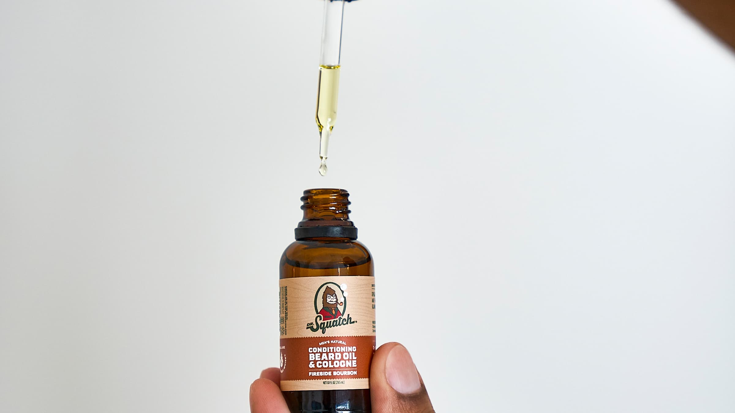 Dr. Squatch Conditioning Beard Oil & Cologne Fireside Bourbon being used