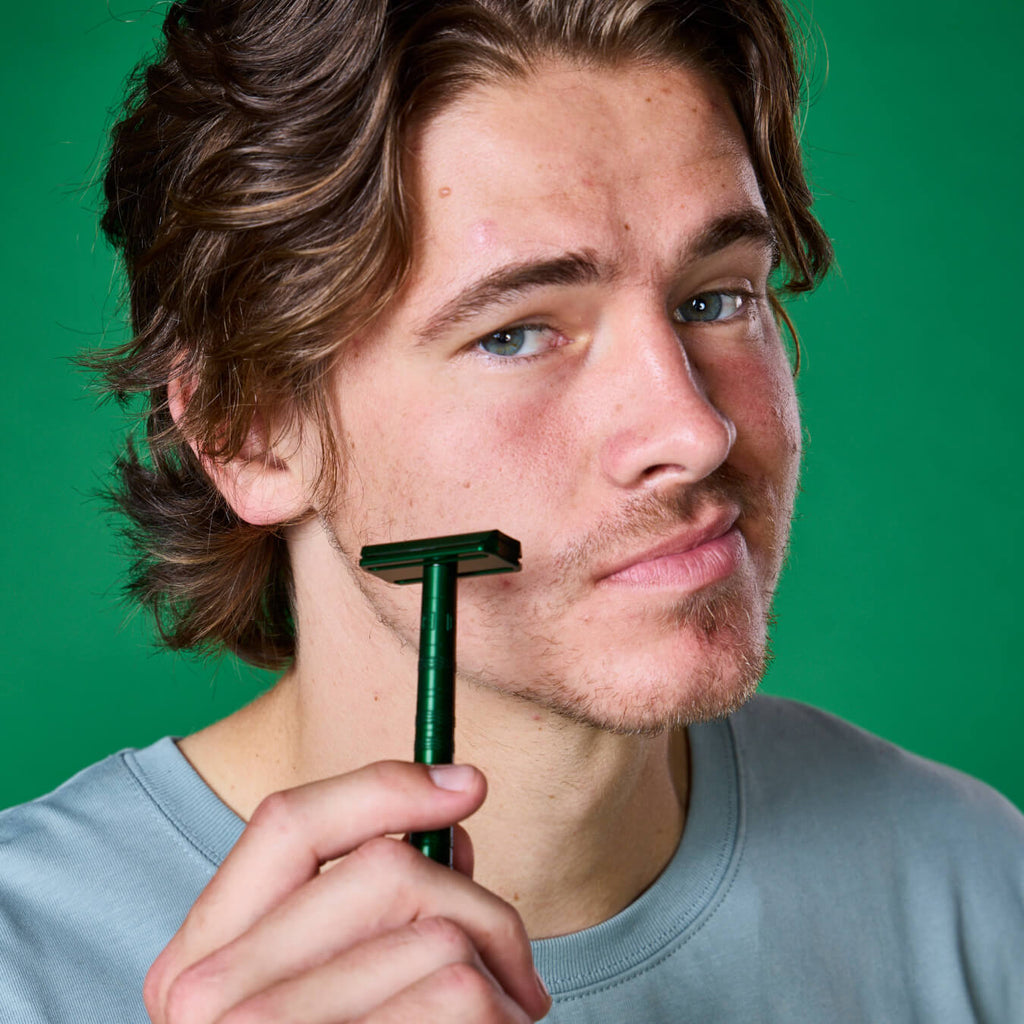 Promotional graphic for Dr. Squatch Safety Razor