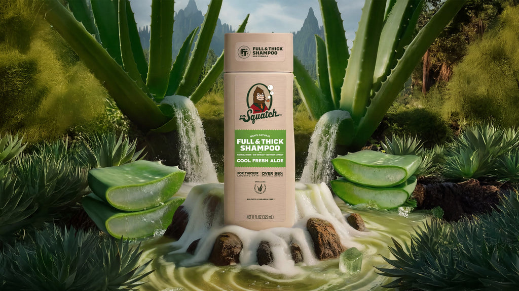 Shampoo bottle with aloe vera leaves and agave plants in a natural setting