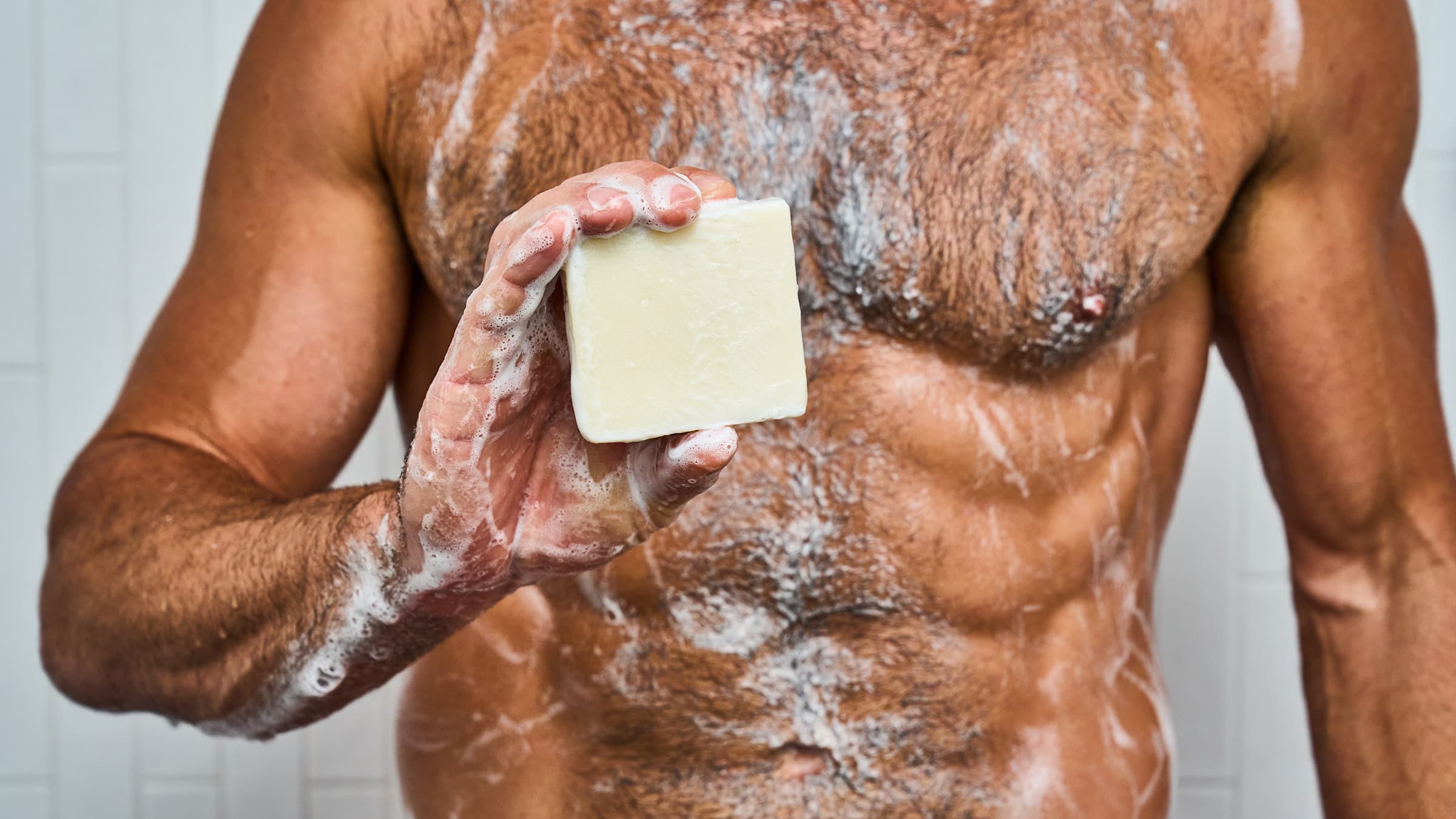 Dr. Squatch Shea Butter bar soap being used