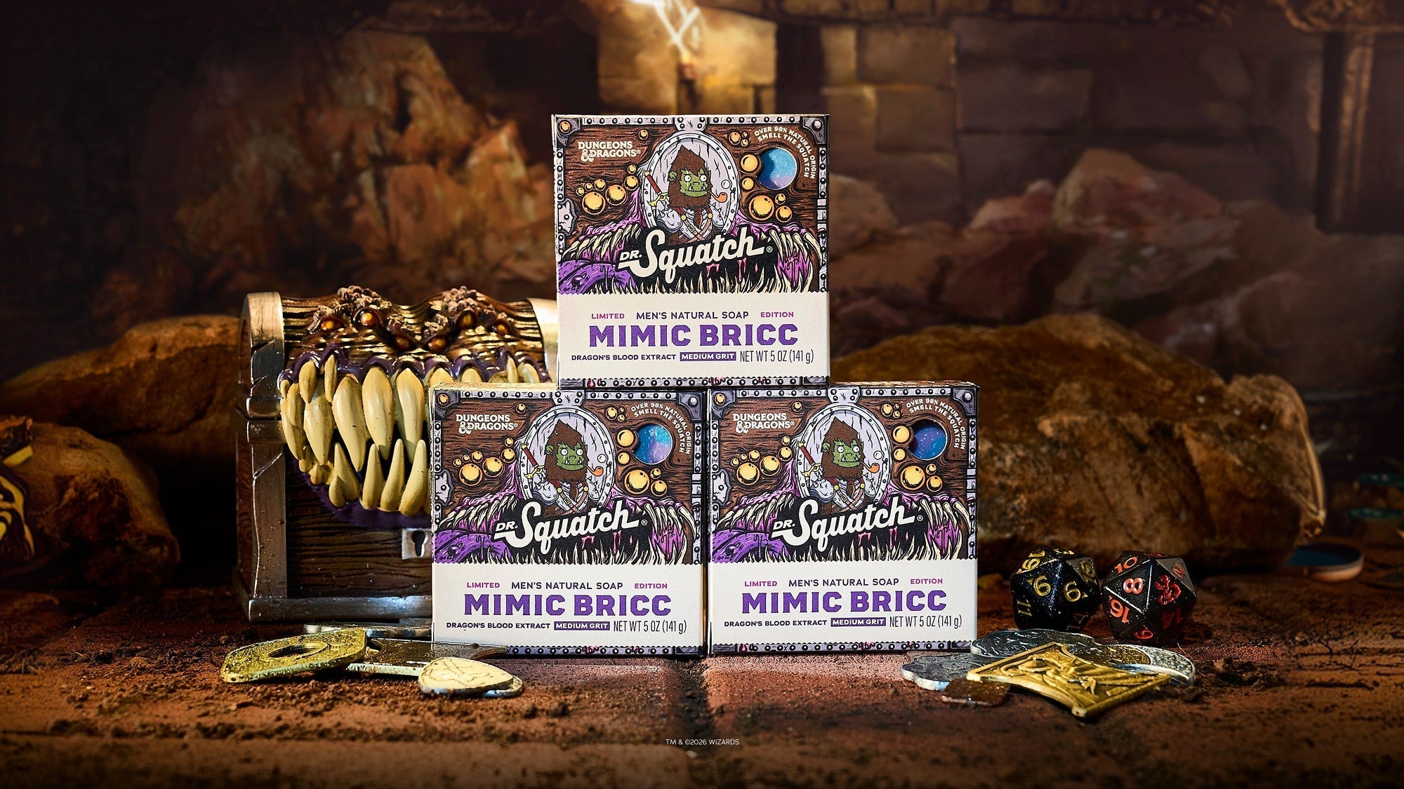 Three boxes of Dr. Squatch Mimic Bricc soap displayed on a wooden surface with fantasy props and dice.