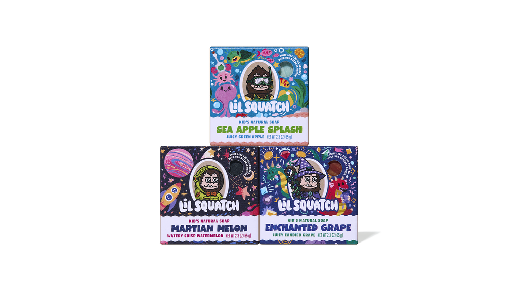Three colorful Lil Squatch kid's natural soap bars stacked in a pyramid: Sea Apple Splash (top), Martian Melon and Enchanted Grape (bottom).