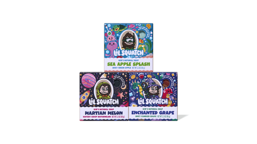 Three colorful Lil Squatch kid's natural soap bars stacked in a pyramid: Sea Apple Splash (top), Martian Melon and Enchanted Grape (bottom).