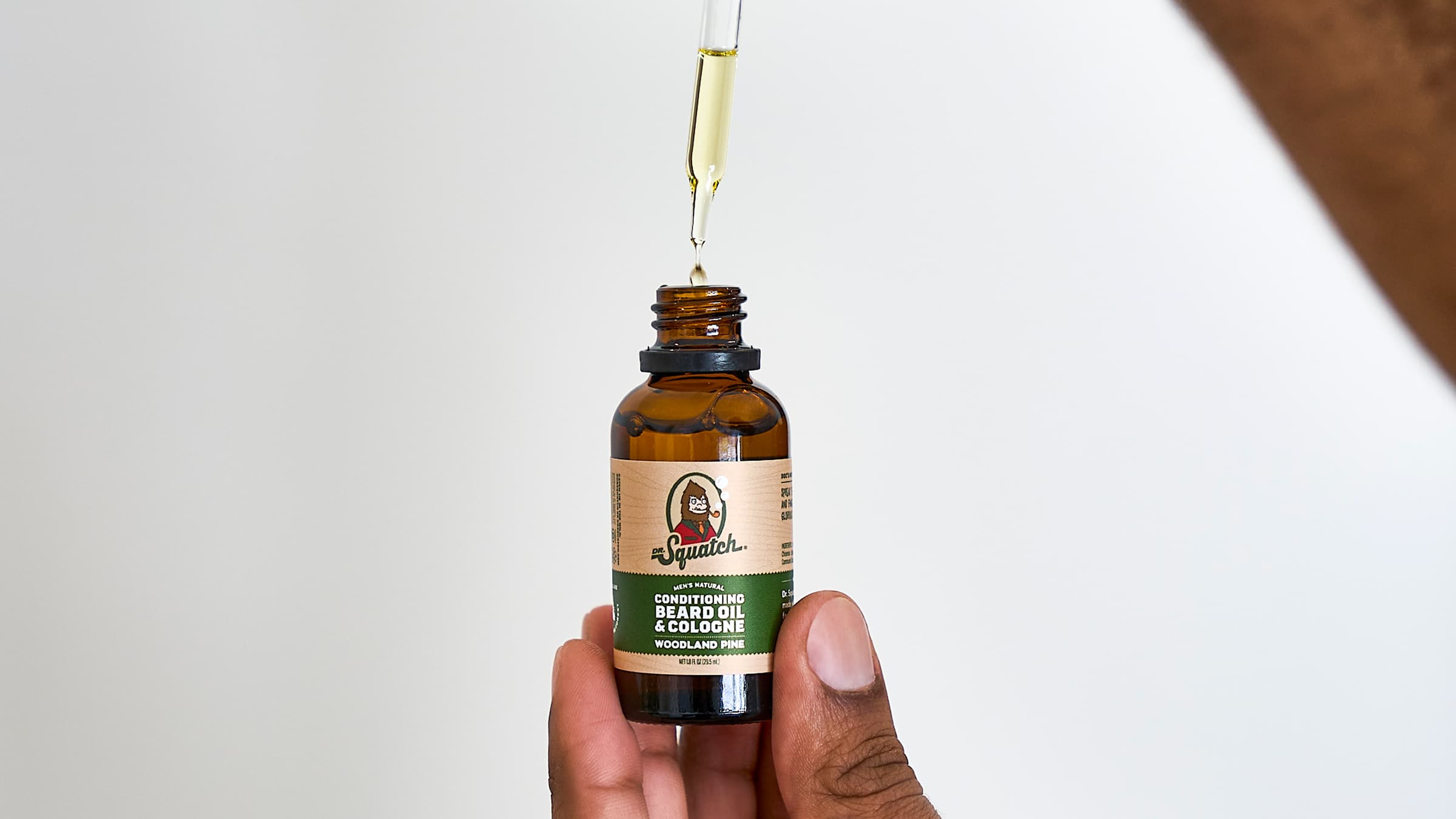 Dr. Squatch Conditioning Beard Oil & Cologne Woodland Pine being used